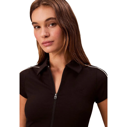 Calvin Klein Jeans Schwarzes Damen-Poloshirt aus Viskose mit kurzen Ärmeln, weißer Paspelierung und Reißverschluss vorne