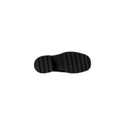 Calvin klein jeans women black wool slip on shoes showing black rubber sole with chunky ridged tread pattern