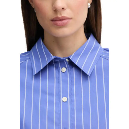 Calvin Klein Jeans women blue striped long sleeve shirt with blue and white vertical stripes and a crisp collar