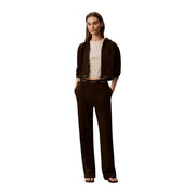 A sleek black Calvin Klein cotton hoodie with subtle logo trim paired with wide-leg trousers for women