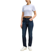 Dark wash denim jeans with classic straight leg cut and visible stitching details paired with calvin klein lilac cotton t-shirt