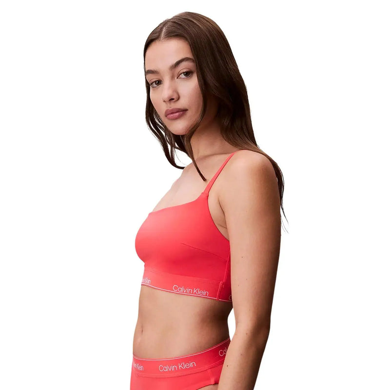 Vibrant coral calvin klein jeans women orange bralette with thin straps and sleek modern design for beachwear