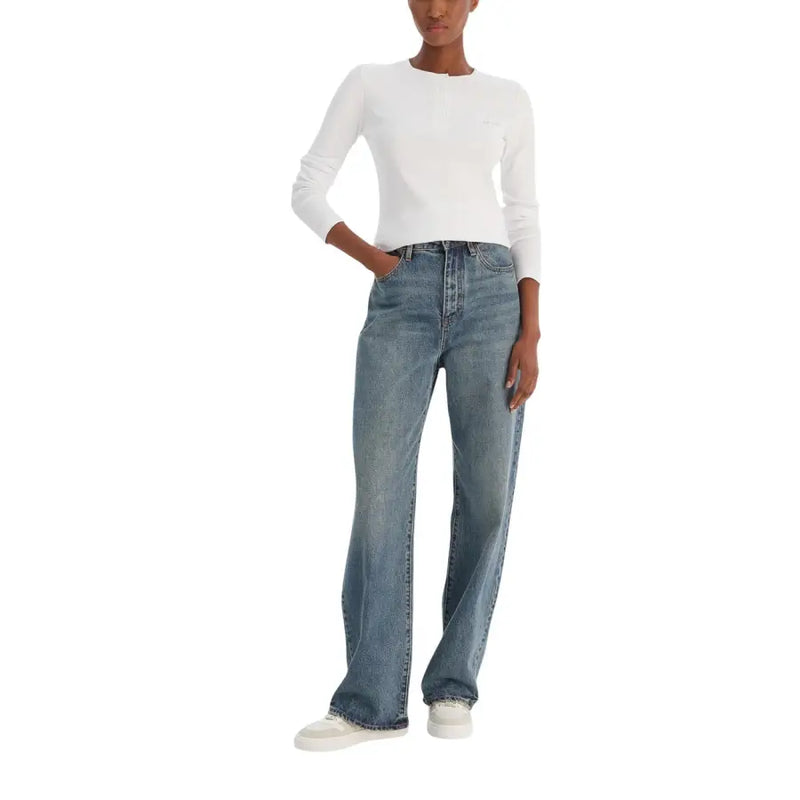 Calvin klein jeans women white long sleeve knitwear paired with high-waisted medium-blue straight-leg denim jeans