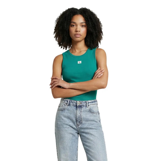 Calvin Klein jeans women white sleeveless round neck top featuring a teal tank with a small white logo on the chest