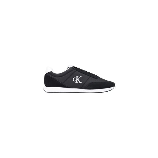 Black Calvin Klein men textile sneaker featuring white logo and sole, designed for casual wear