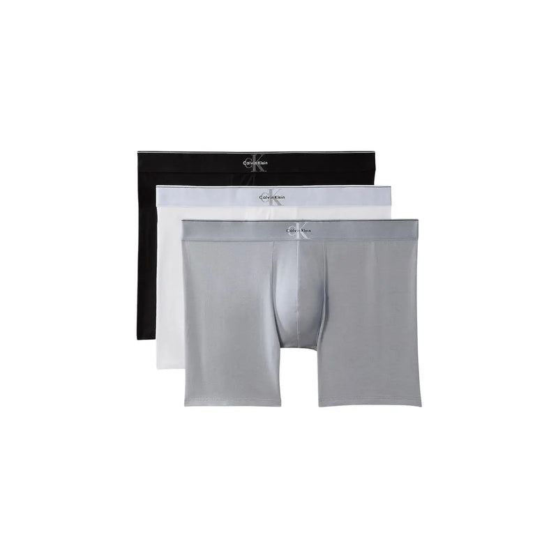 Set mit drei Calvin Klein Herren-Boxershorts in Schwarz, Weiß und Silber aus dehnbarem Baumwollgewebe