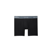 Black Calvin Klein boxer briefs with a gray waistband featuring the brand logo for men’s underwear use