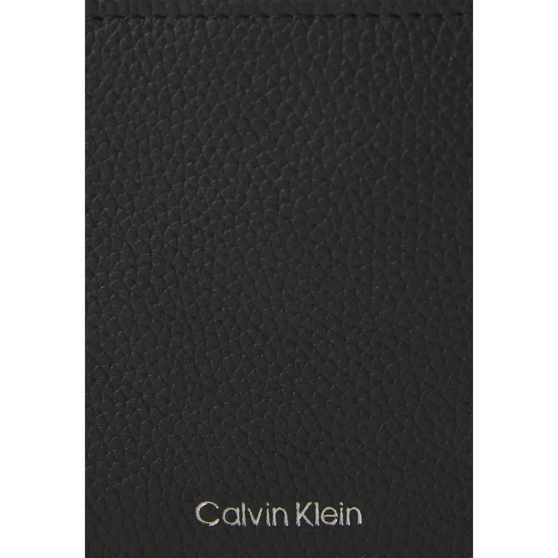 Calvin Klein men wallet in black textured leather with silver Calvin Klein logo on front side