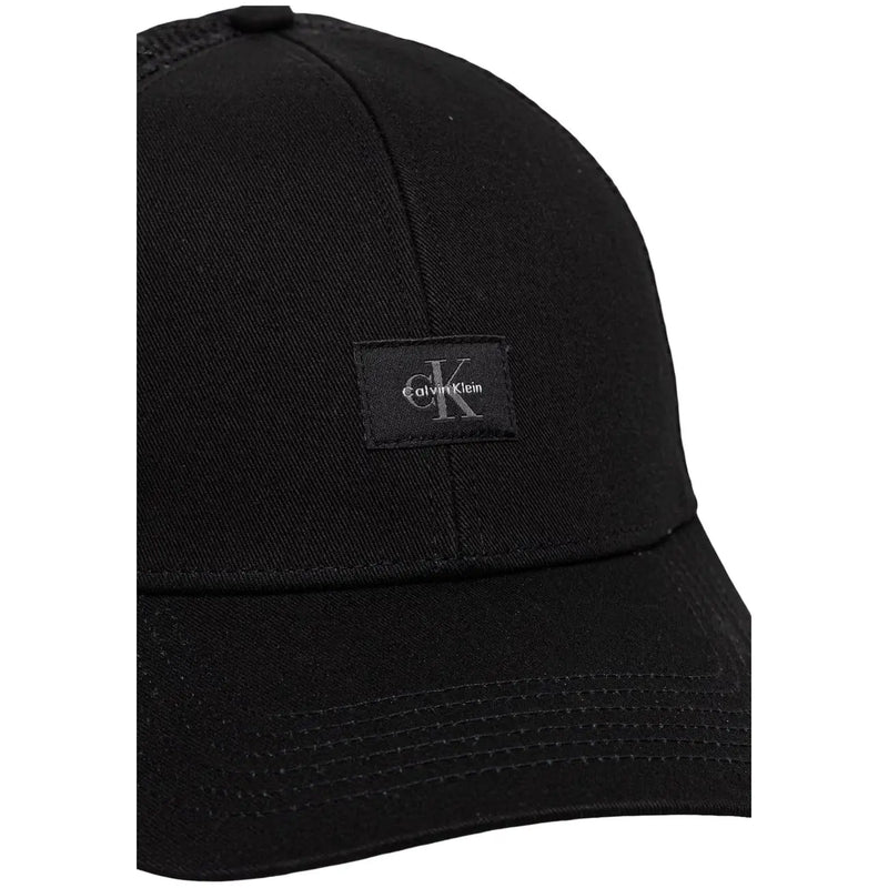 Calvin Klein Schwarze Herren-Truckerkappe aus Baumwolle mit Monologo, dezent strukturiertem Stoff und kleinem, gesticktem Logo-Aufnäher