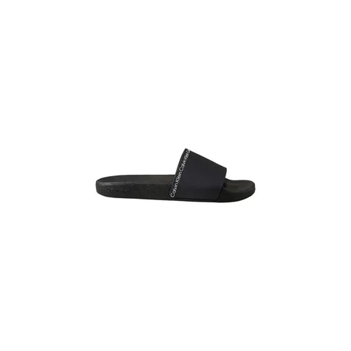 Schwarze Calvin Klein Herren-Slipper aus Polyurethan, elegantes, minimalistisches Design und weißes Logo am Riemen