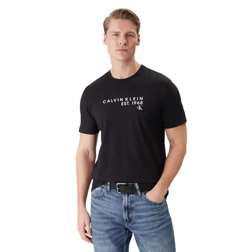 Black calvin klein men t shirt with white logo print made of cotton with round neck for casual wear