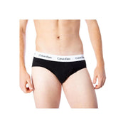 Black Calvin Klein men’s briefs with a white elastic waistband featuring the brand’s repeating logo in cotton fabric