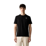 Calvin Klein Schwarzes Herren-T-Shirt aus Baumwolle, klassische Passform, mit kleinem weißen CK-Logo auf der linken Brust.