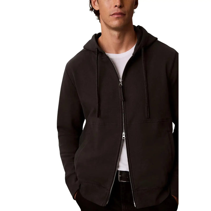 Grauer Herren-Hoodie von Calvin Klein aus Baumwolle mit schwarzer Reißverschluss-Kapuzenpartie, Kordelzug und Vordertaschen.