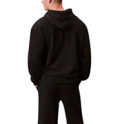 Calvin Klein Sport Schwarzer Herren-Hoodie aus Baumwolle, von hinten gesehen, mit einer mittigen Naht entlang der Kapuze.