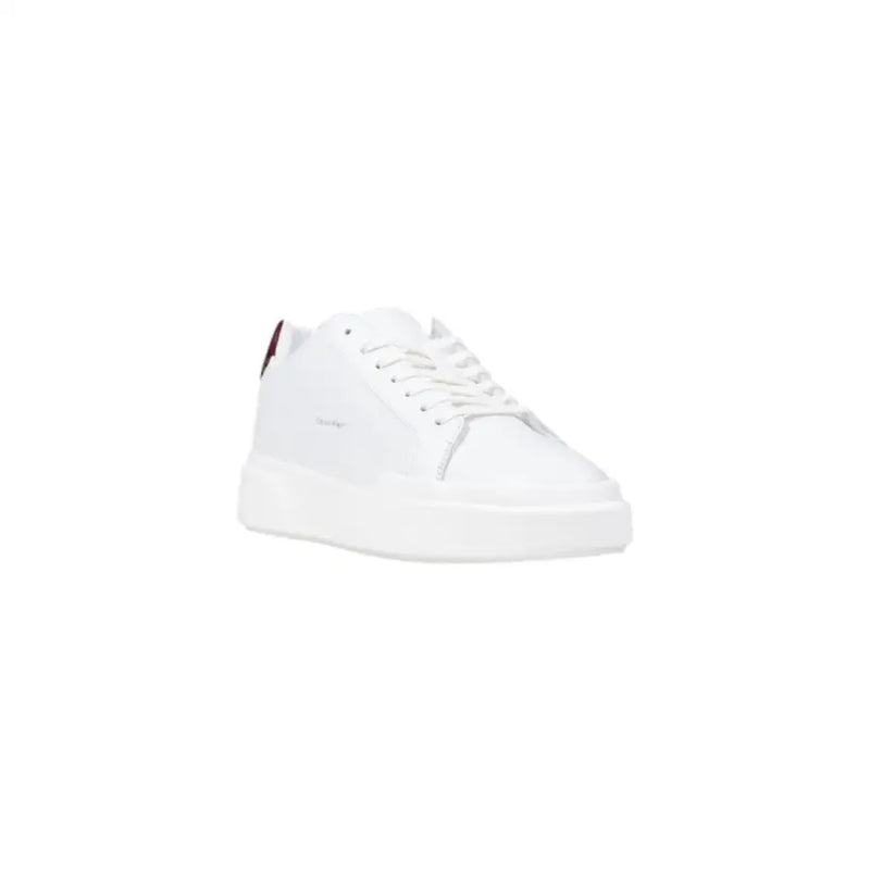 White leather sneaker with red and blue accents, tommy hilfiger logo.