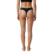 Schwarzer Calvin Klein Damen-Tanga im brasilianischen Stil aus Baumwoll-Modal mit weißem Logo und Sternenmuster, von hinten gesehen