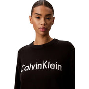 Calvin Klein Schwarzer Damen-Strickpullover aus Baumwolle mit Rundhalsausschnitt und weißem Stricklogo auf der Brust