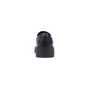 Calvin Klein women leather black loafer with a chunky platform sole shown from the back side