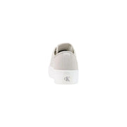 Light gray canvas slip-on sneaker with white rubber sole and Calvin Klein logo on the heel back side shown