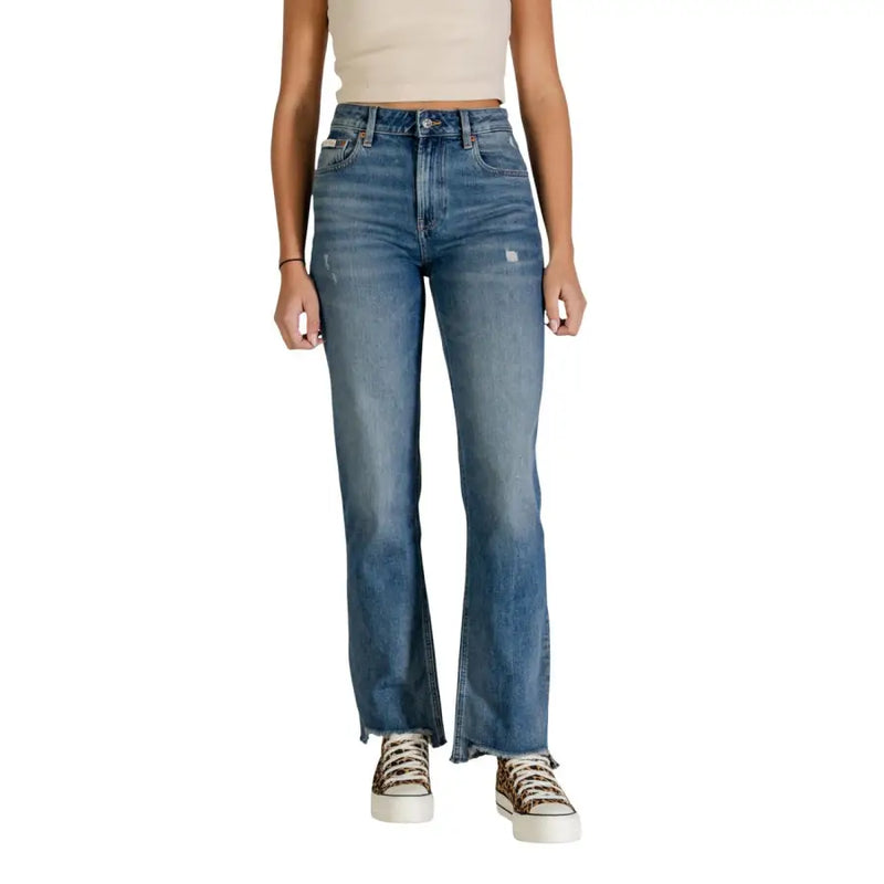 High-rise light blue denim flare jeans by Calvin Klein with distressed faded wash and frayed hems for women