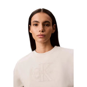 Cream-colored Calvin Klein women white cotton sweatshirt with subtle embroidered CK logo across the chest