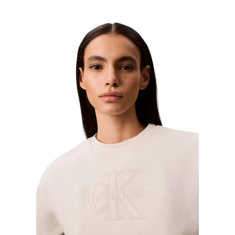Cream-colored Calvin Klein women white cotton sweatshirt with subtle embroidered CK logo across the chest