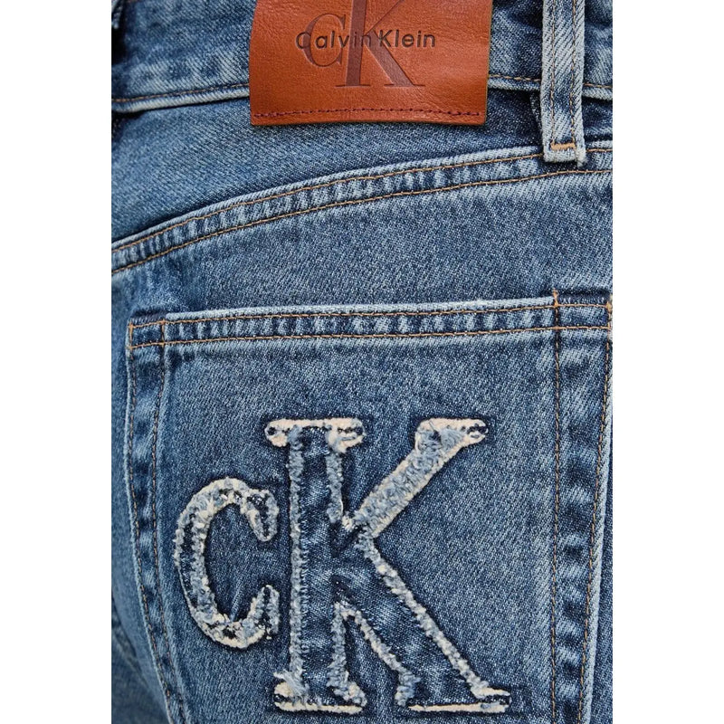 Back side of calvin klein women’s light blue cotton denim jeans with distressed embroidered ck logo and brown leather patch
