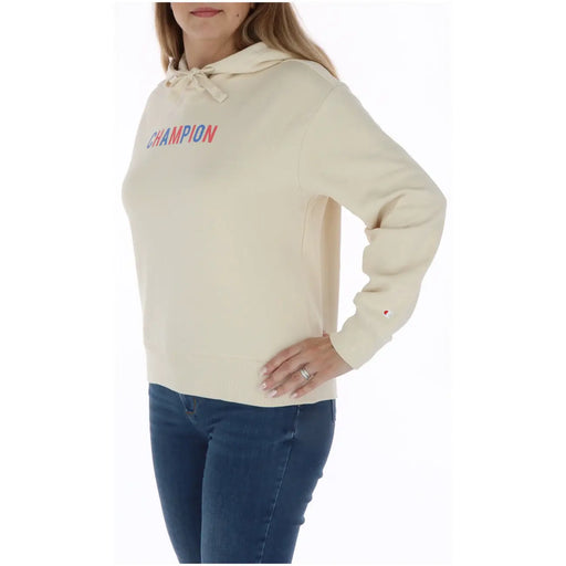 Champion Beigefarbener Damen-Hoodie aus Baumwolle mit cremefarbener Kapuze mit Kordelzug und rot-blauem Logo-Aufdruck auf der Brust.