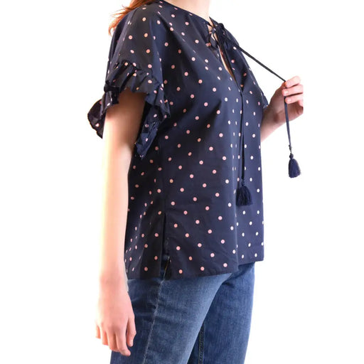Navy blue polka dot peasant blouse with ruffled sleeves and tassel ties for women