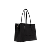 Black leather tote bag for women by Coccinelle featuring embossed branding and textured side panel W40.5
