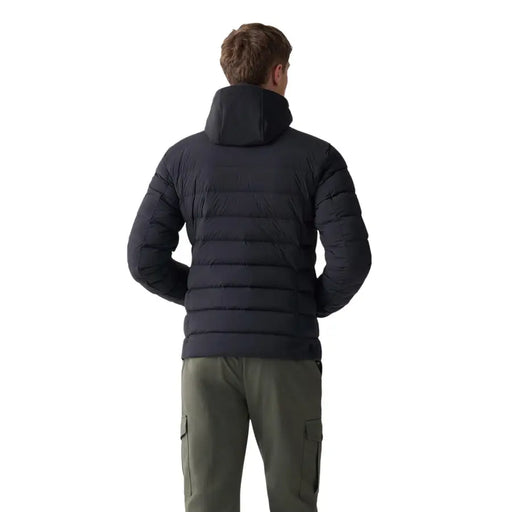 Black puffer jacket with hood and quilted design, likely made of synthetic material for warmth.