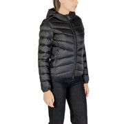 Woman wearing Colmar Originals black hooded puffer jacket with diagonal quilting and front zipper