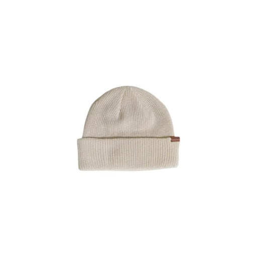 Cream-colored beanie with ribbed texture and brown leather patch on the brim.