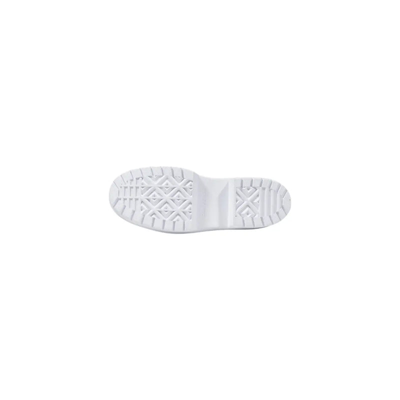White rubber shoe sole with geometric tread pattern of converse women black fabric chuck taylor sneakers back side