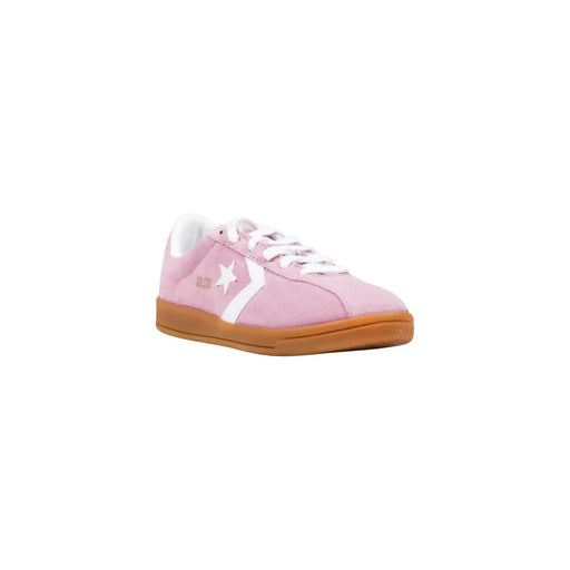 Converse Damen-Sneaker aus Leder, Modell „Classic Ox“, in Pink mit rosa Wildleder, weißem Stern- und Streifenmuster und hellbrauner Gummisohle.