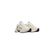 Converse women slip on fabric sneakers in cream-colored canvas with chunky black rubber sole and white laces
