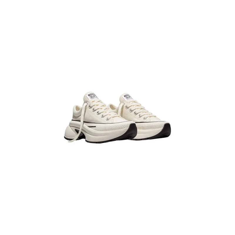 Converse women slip on fabric sneakers in cream-colored canvas with chunky black rubber sole and white laces