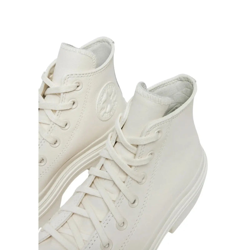 Converse women white leather platform boots featuring high-top design with matching laces and classic rubber sole