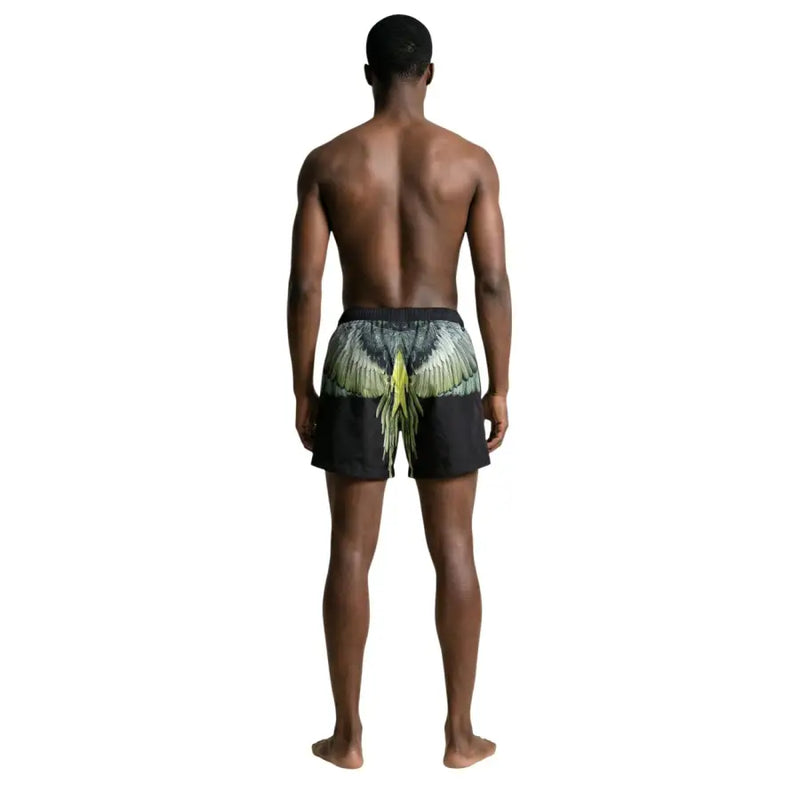 Black swim trunks by county of milan featuring colorful green and yellow wing design on the back for men swimwear