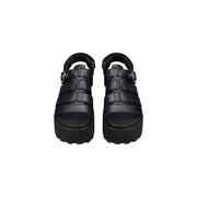 Cult women black leather platform sandals with woven strap design and silver-toned buckle accents