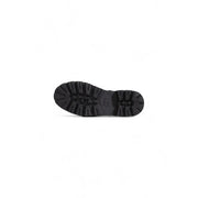 Black rubber sole of cult women leather sandals featuring deep rugged tread and embossed logo near the heel