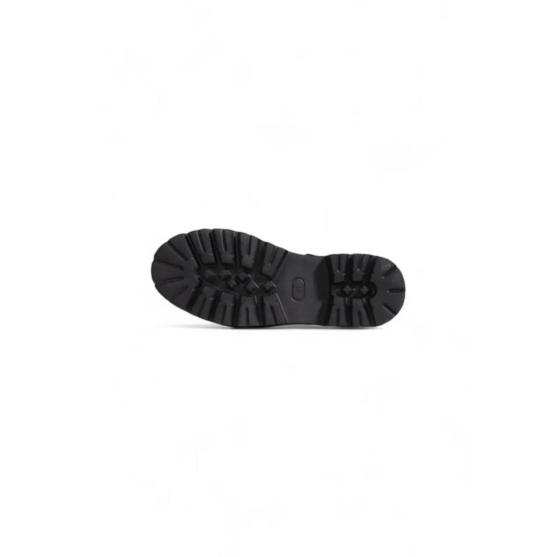 Black rubber sole of cult women leather sandals featuring deep rugged tread and embossed logo near the heel