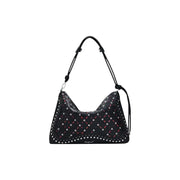 Black studded shoulder bag with pink and white crisscross pattern from Desigual