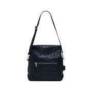 Black leather shoulder bag with embossed patterns and front zipper pocket for women