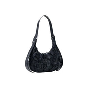 Desigual black leather hobo bag with dimensional floral appliqués and zippered interior pocket