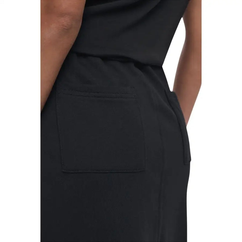 Black jumpsuit with side and back pockets, perfect for fall and winter wear