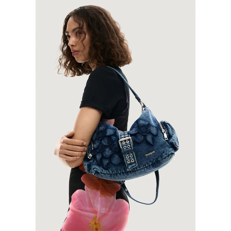 Desigual blue denim shoulder bag with floral appliqué silver-tone hardware and multiple pockets for daily use