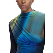 Close-up of a woman wearing Desigual Blue Long Round Neck Dress with abstract print top