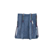 Desigual blue zippered denim bucket bag with colorful braided trim and silver zipper featuring multiple pockets